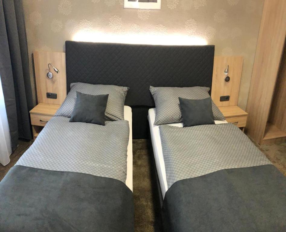 Postel nebo postele na pokoji v ubytování Penzion Ema B&B