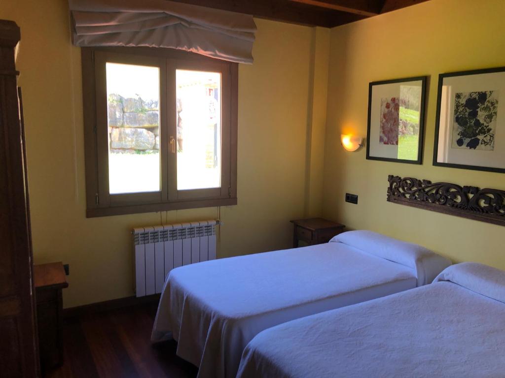 Postel nebo postele na pokoji v ubytování Apartamentos Monterodiles