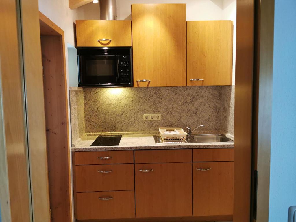 Kuchyň nebo kuchyňský kout v ubytování Ferienwohnung Sunkler