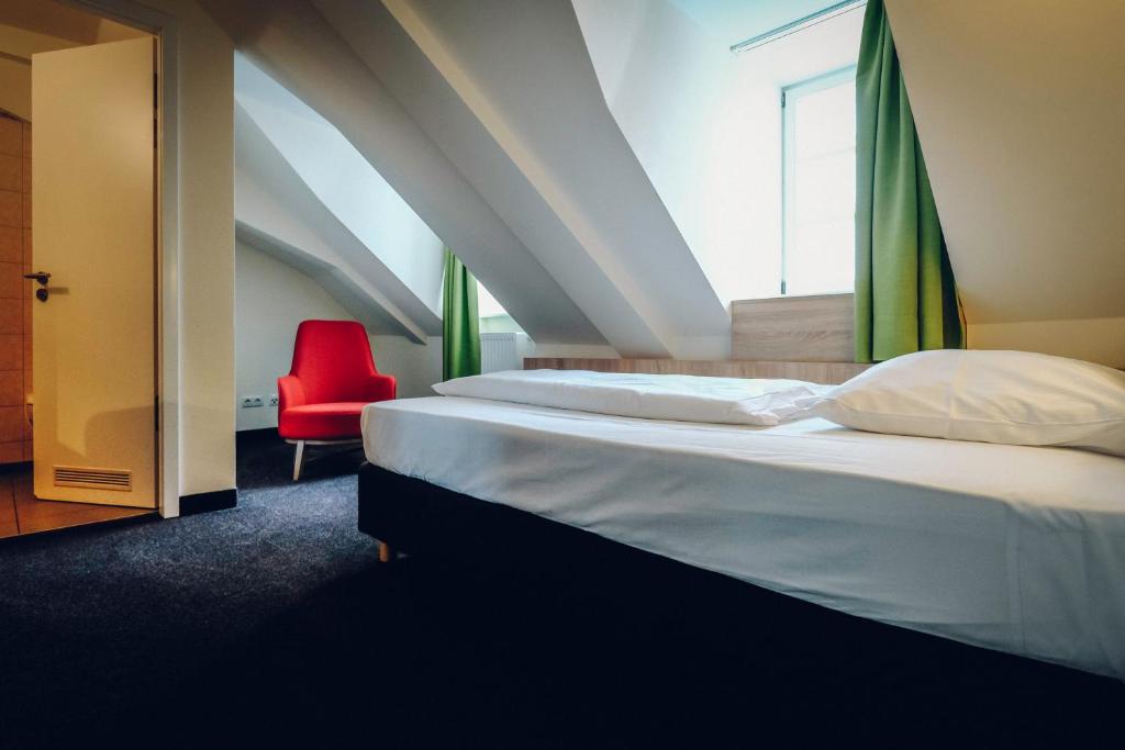 Postel nebo postele na pokoji v ubytování Hotel Europa