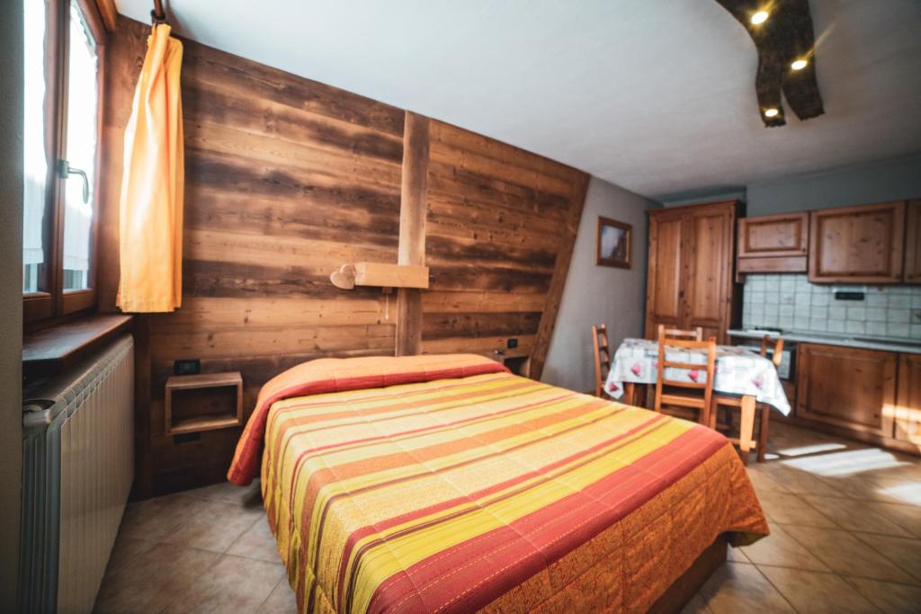 Postel nebo postele na pokoji v ubytování Chalet Della Guida