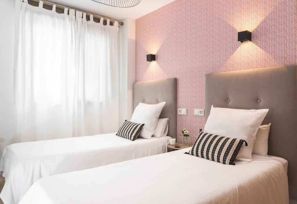 Posteľ alebo postele v izbe v ubytovaní Pacificio Beachfront