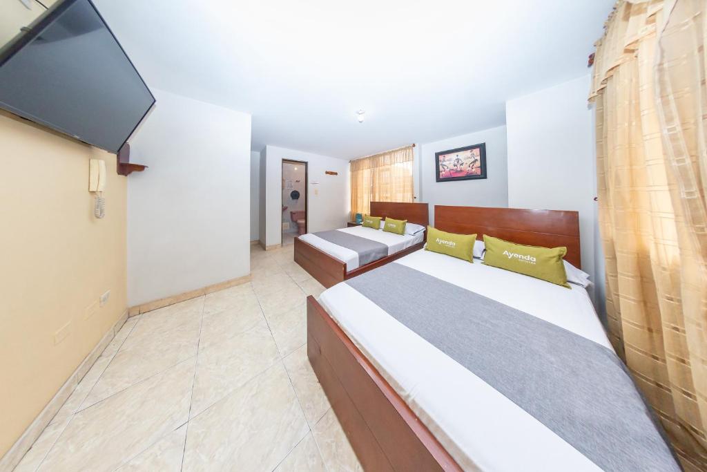 Postel nebo postele na pokoji v ubytování Hotel Home Bioma 1010