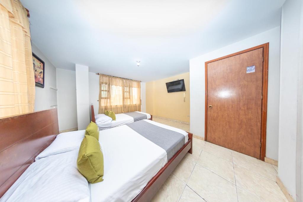 Postel nebo postele na pokoji v ubytování Hotel Home Bioma 1010