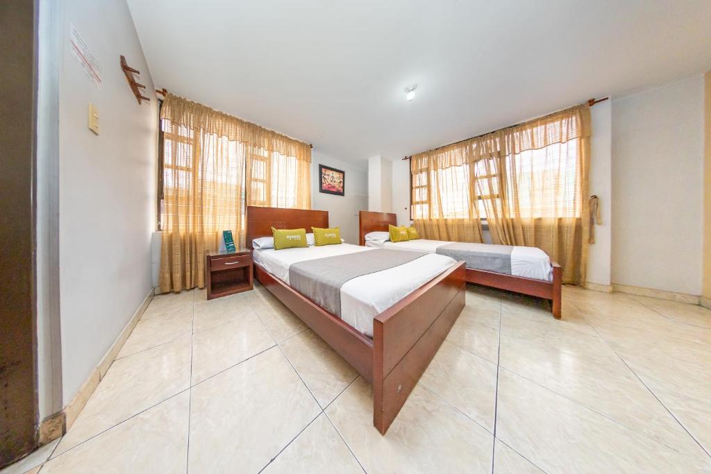 Postel nebo postele na pokoji v ubytování Hotel Home Bioma 1010