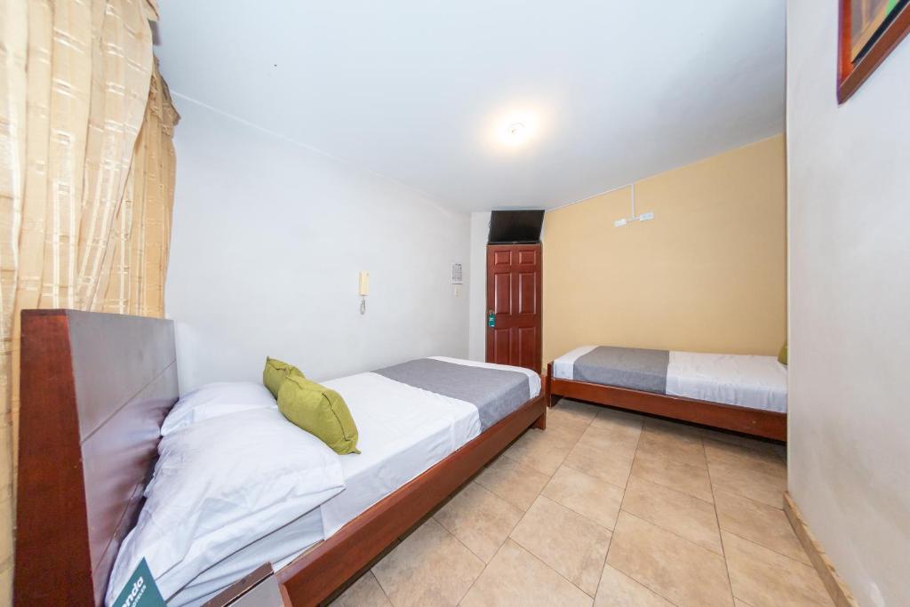 Postel nebo postele na pokoji v ubytování Hotel Home Bioma 1010