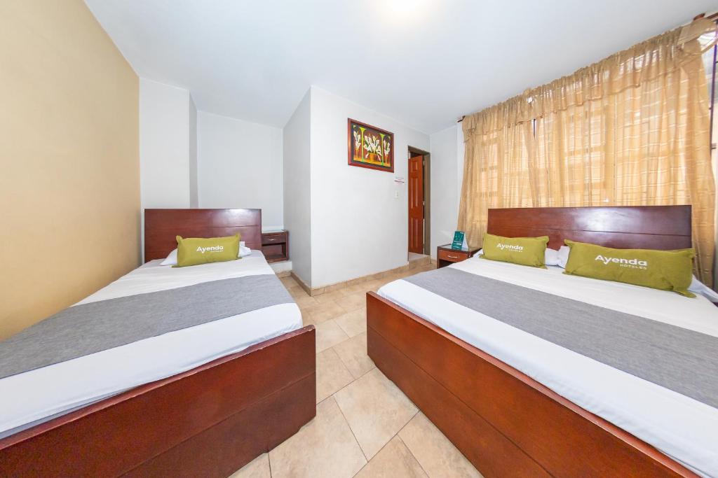 Postel nebo postele na pokoji v ubytování Hotel Home Bioma 1010
