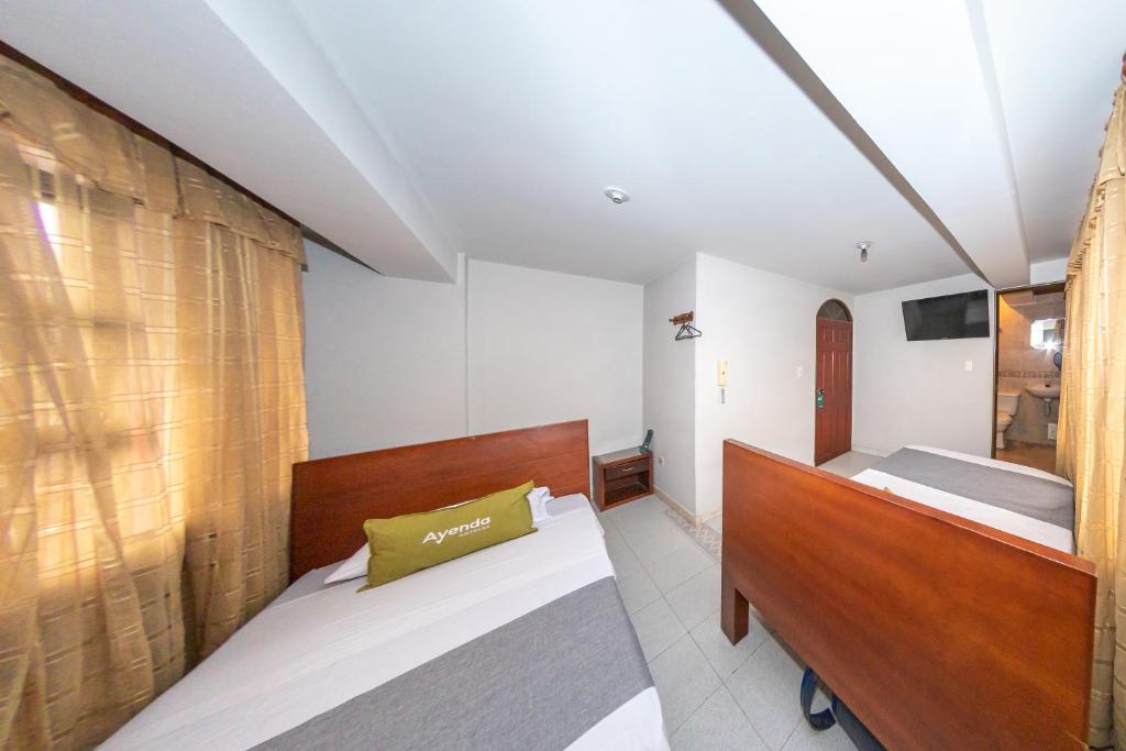 Postel nebo postele na pokoji v ubytování Hotel Home Bioma 1010