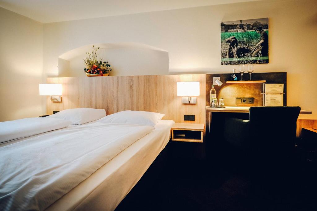 Postel nebo postele na pokoji v ubytování Hotel Europa