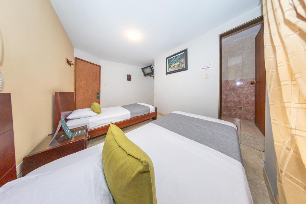 Postel nebo postele na pokoji v ubytování Hotel Home Bioma 1010