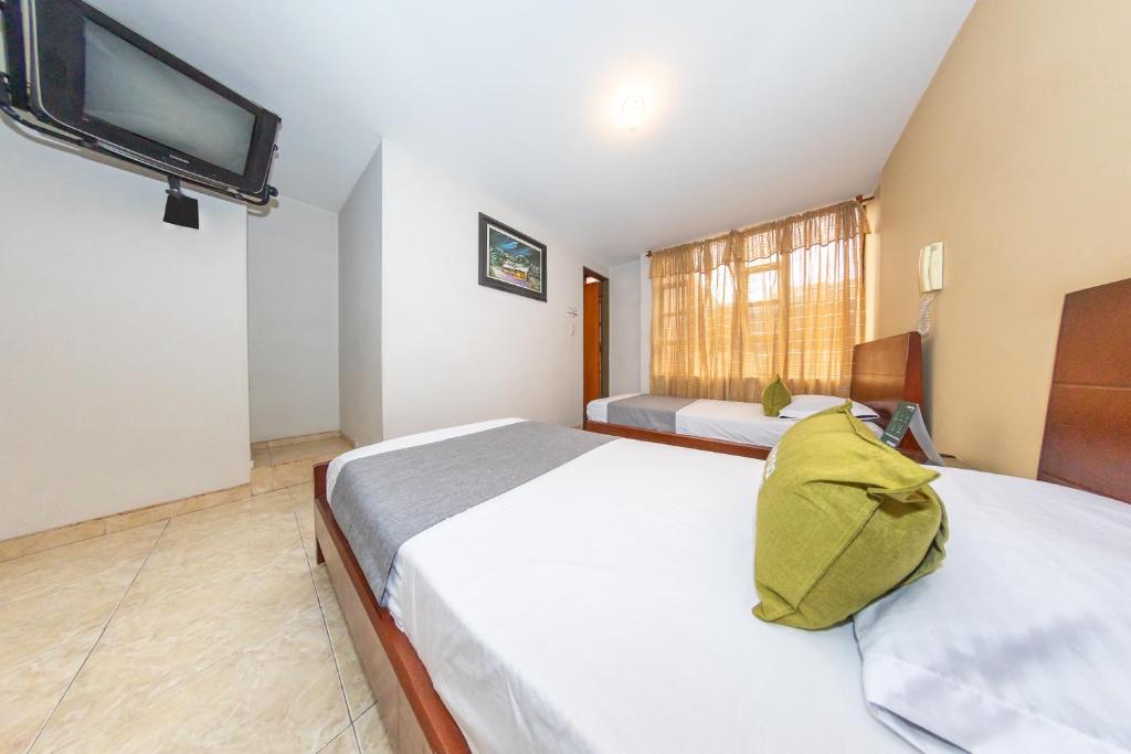 Postel nebo postele na pokoji v ubytování Hotel Home Bioma 1010