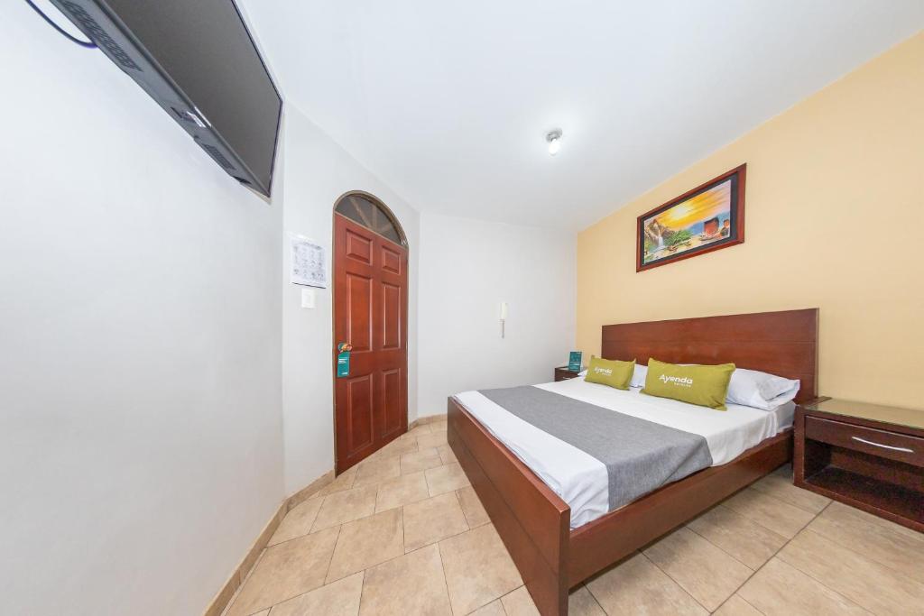 Postel nebo postele na pokoji v ubytování Hotel Home Bioma 1010
