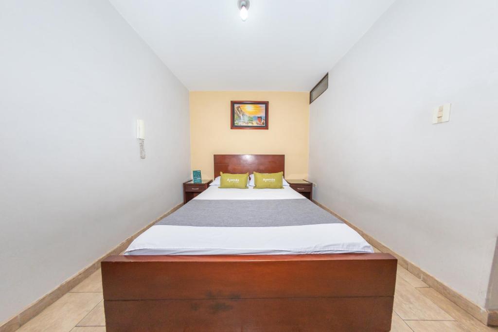 Postel nebo postele na pokoji v ubytování Hotel Home Bioma 1010
