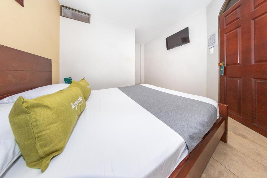 Postel nebo postele na pokoji v ubytování Hotel Home Bioma 1010