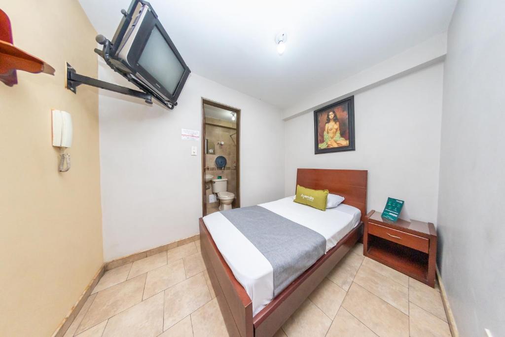 Postel nebo postele na pokoji v ubytování Hotel Home Bioma 1010