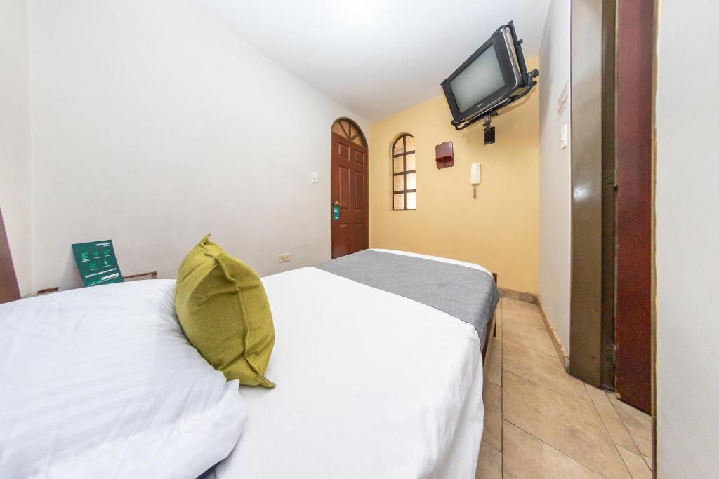 Postel nebo postele na pokoji v ubytování Hotel Home Bioma 1010