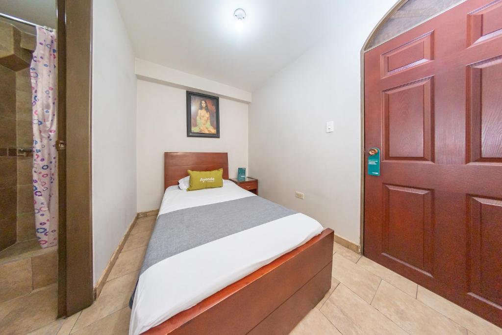 Postel nebo postele na pokoji v ubytování Hotel Home Bioma 1010