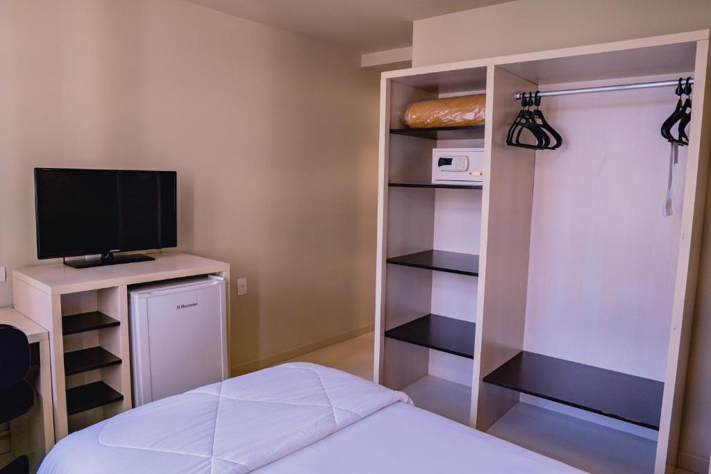 Postel nebo postele na pokoji v ubytování Master Curitiba Hotel - 1,6 km do Estádio Couto Pereira - Show