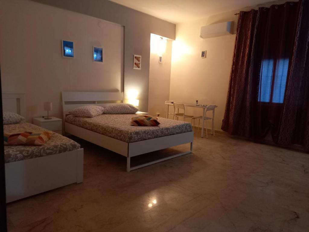 Postel nebo postele na pokoji v ubytování B&B SICILIA