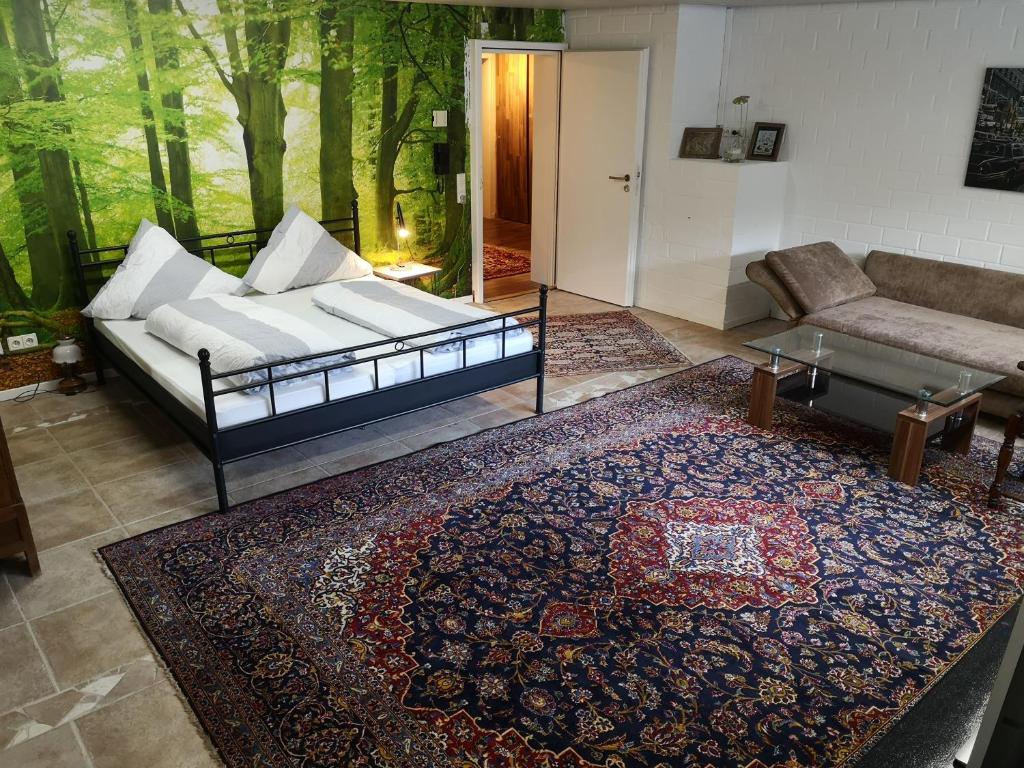 a living room with a couch and a rug at Wohnlich in Würselen