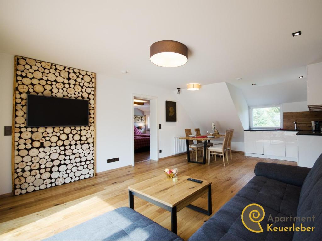 a living room with a couch and a table at Apartment Keuerleber in Holzmaden