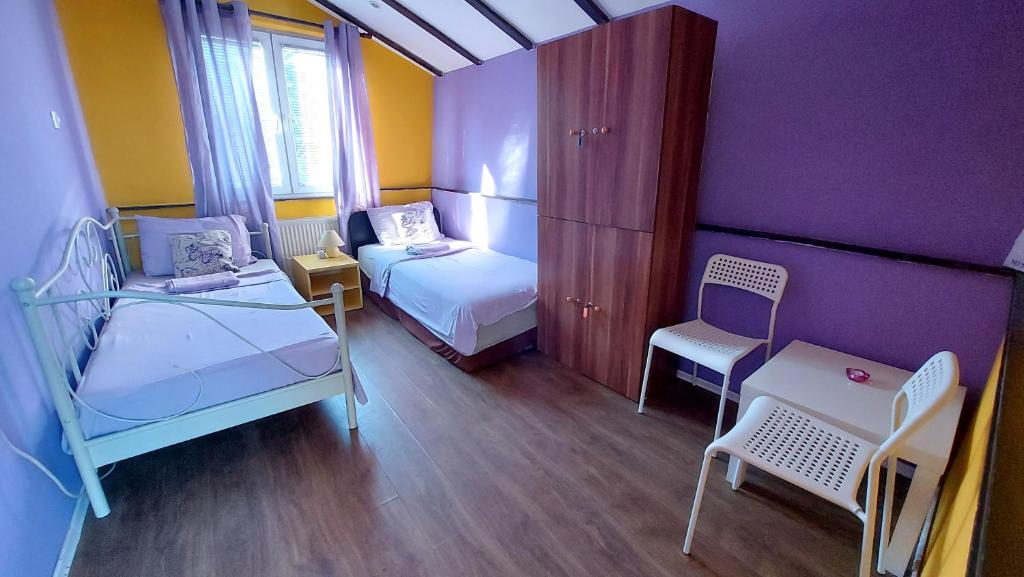 Postel nebo postele na pokoji v ubytování Shanti Hostel
