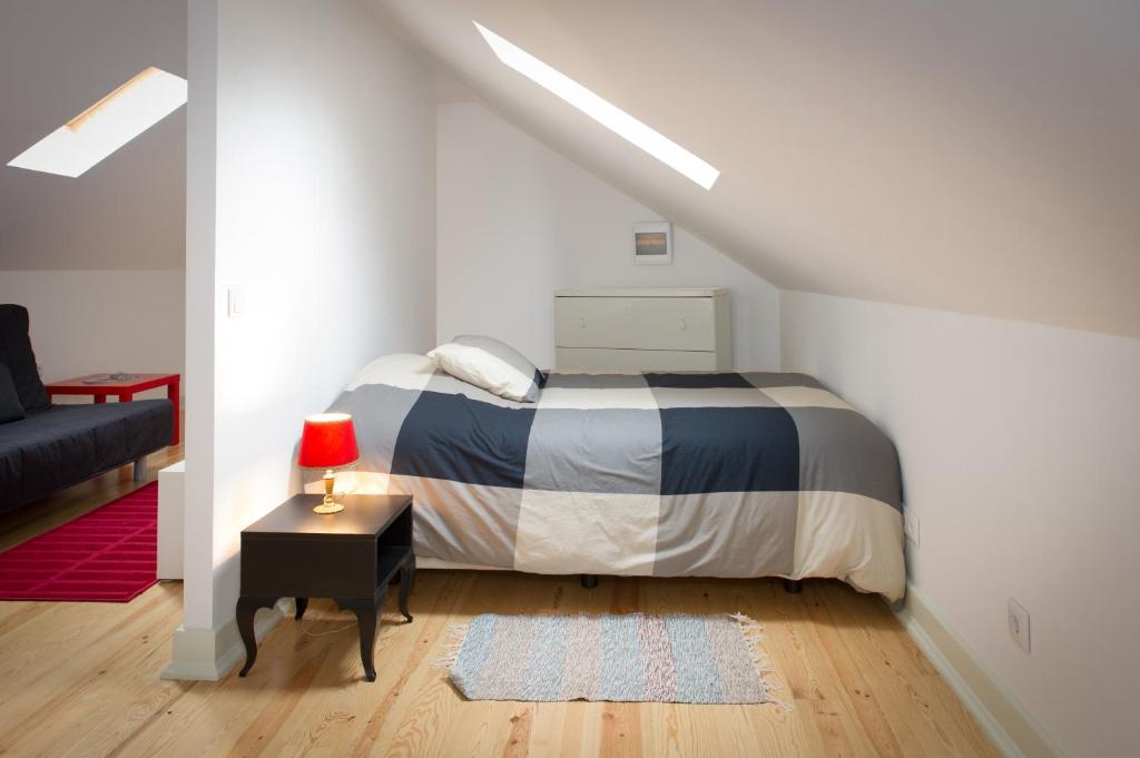 Postel nebo postele na pokoji v ubytování Tram Apartments