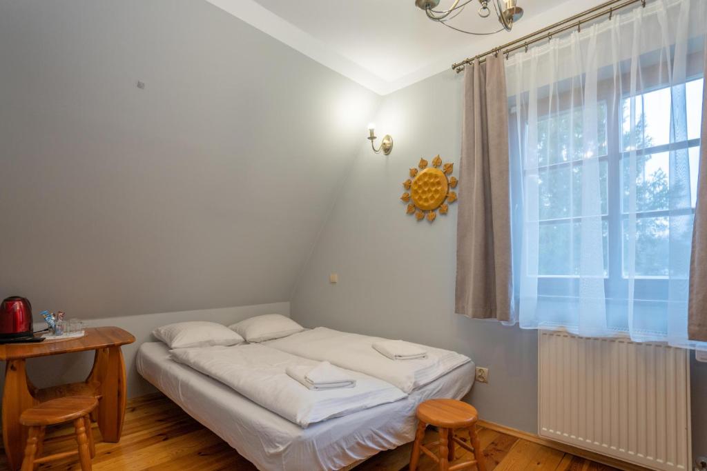 Postel nebo postele na pokoji v ubytování Willa pod Szrenicą