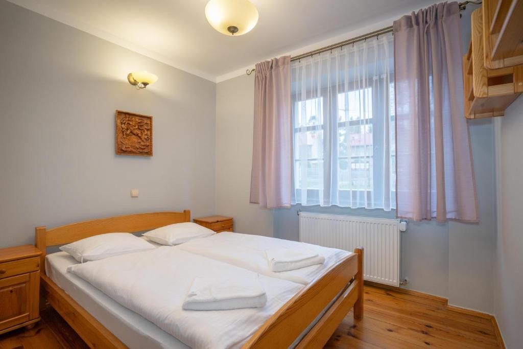 Postel nebo postele na pokoji v ubytování Willa pod Szrenicą