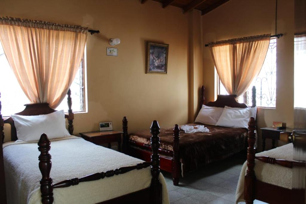 Postel nebo postele na pokoji v ubytování Hotel Tahami