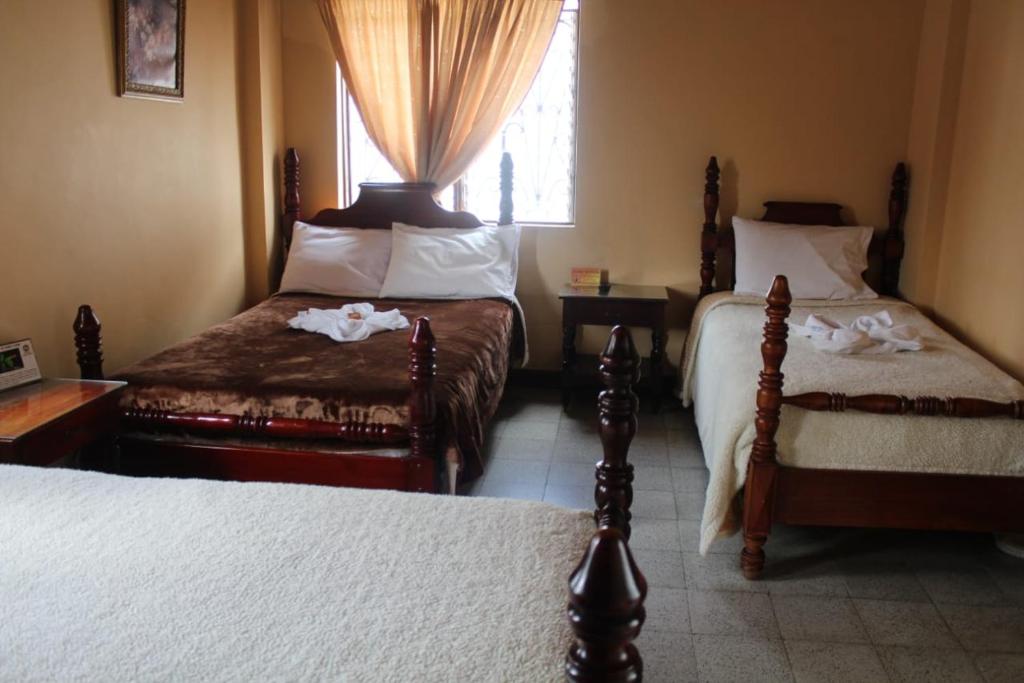 Postel nebo postele na pokoji v ubytování Hotel Tahami