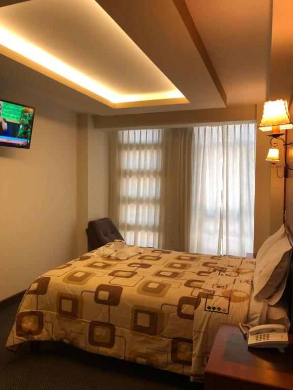 Postel nebo postele na pokoji v ubytování Hotel Imperial