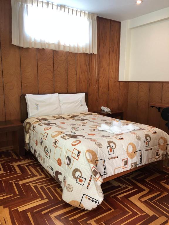 Postel nebo postele na pokoji v ubytování Hotel Imperial