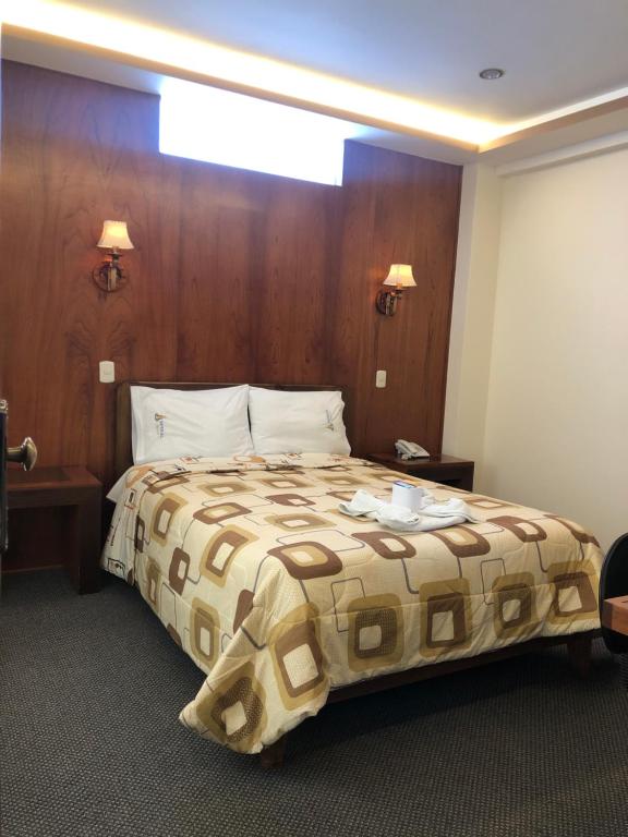 Postel nebo postele na pokoji v ubytování Hotel Imperial