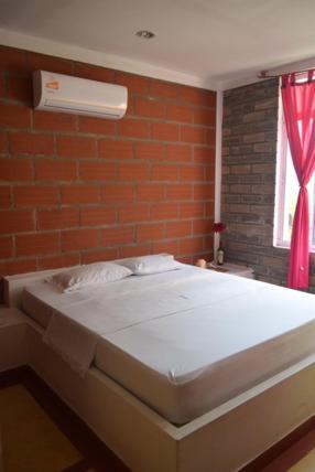 Postel nebo postele na pokoji v ubytování Hostel LA CASA MONO CUCO