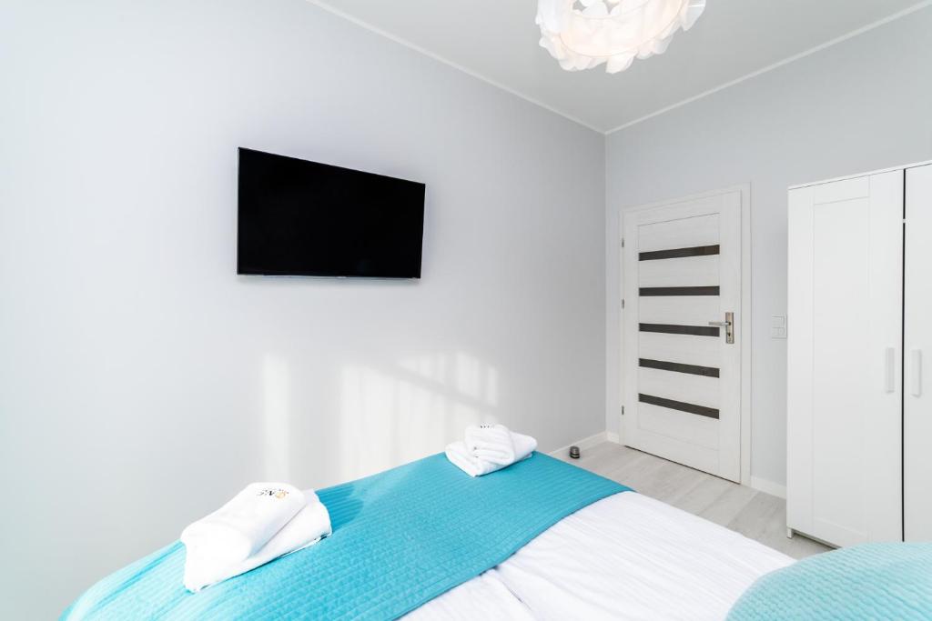 Posteľ alebo postele v izbe v ubytovaní Bright - Neptun Park by OneApartments