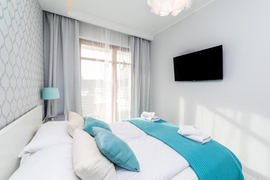Posteľ alebo postele v izbe v ubytovaní Bright - Neptun Park by OneApartments