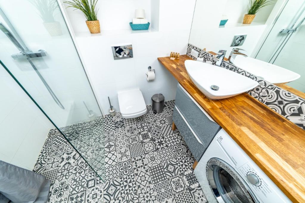 Kúpeľňa v ubytovaní Bright - Neptun Park by OneApartments