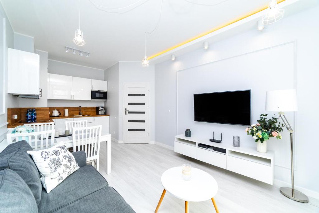 Kuchyňa alebo kuchynka v ubytovaní Bright - Neptun Park by OneApartments