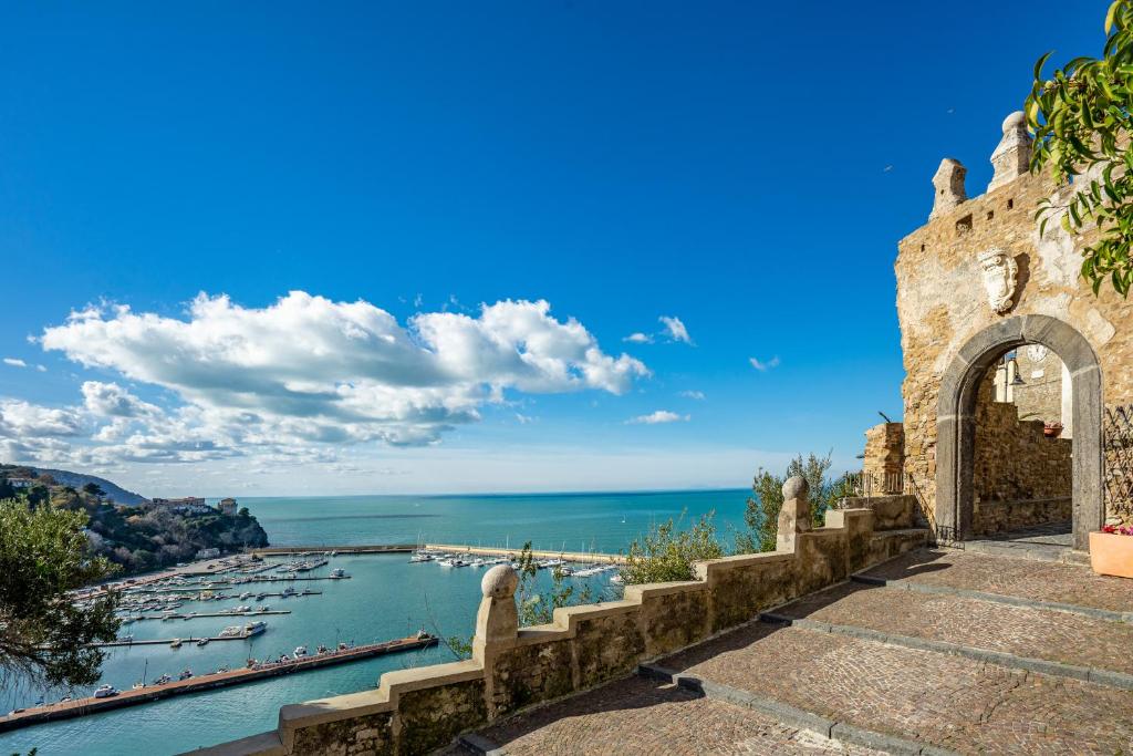 a building with a view of a body of water at Borgo Dei Saraceni - Suites & Apartments in Agropoli
