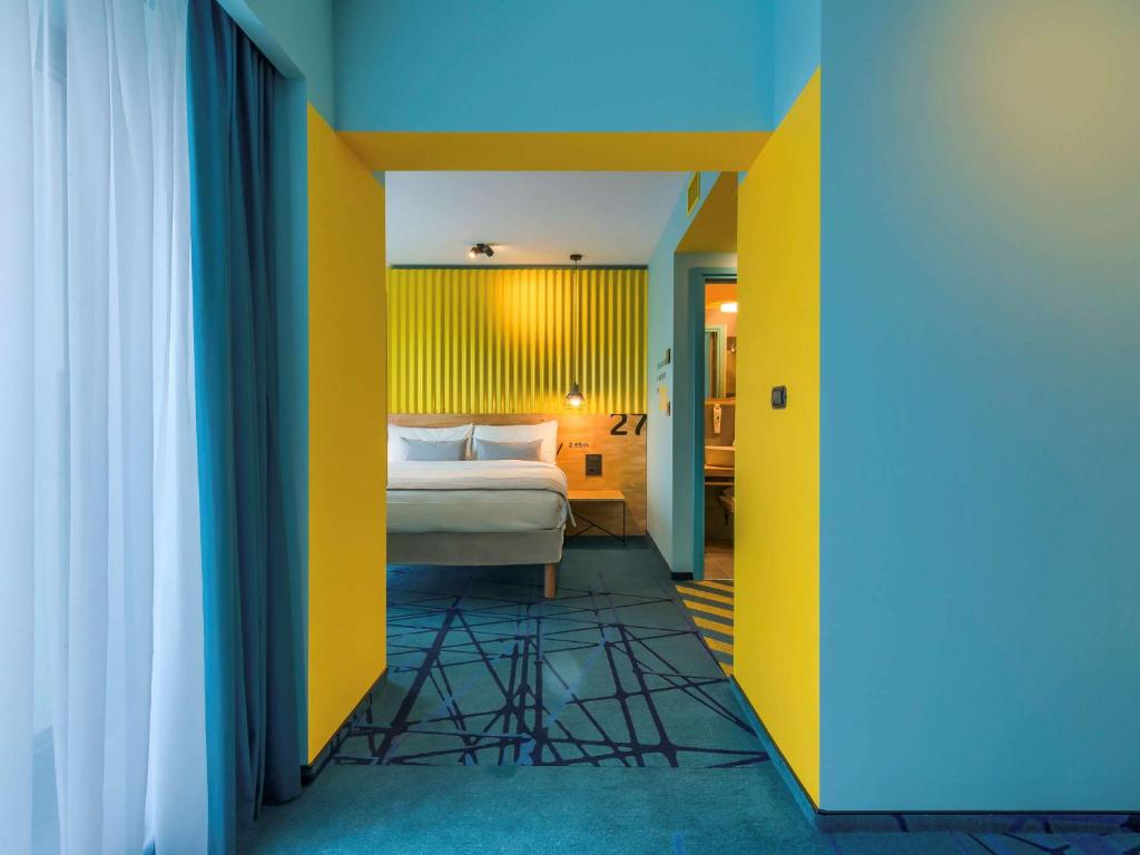 Postel nebo postele na pokoji v ubytování ibis Styles Bucharest Erbas