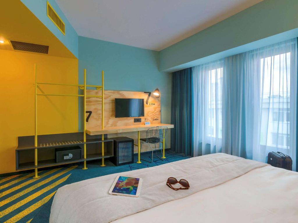 Postel nebo postele na pokoji v ubytování ibis Styles Bucharest Erbas