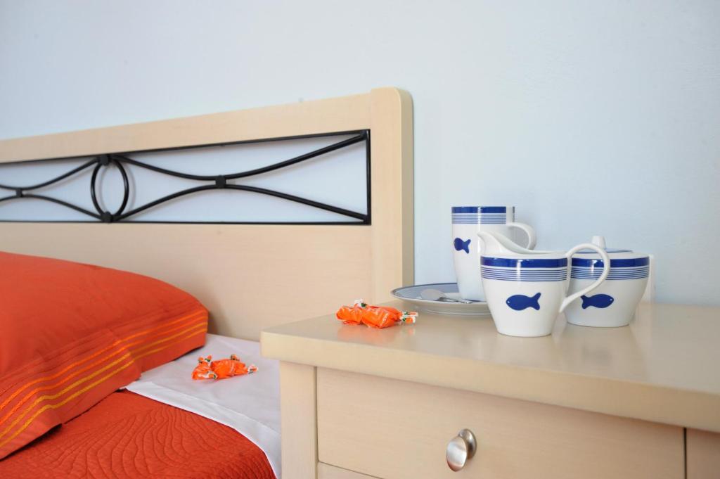 Postel nebo postele na pokoji v ubytování Aigaio Studios tinos