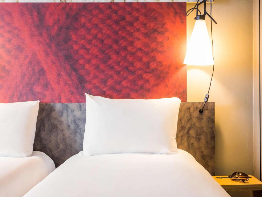 Postel nebo postele na pokoji v ubytování Ibis Hamburg City