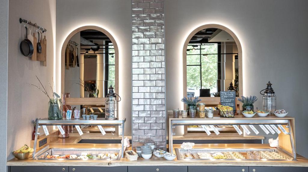 a store with two arched windows in a room at Hotel Indigo Dresden - Wettiner Platz by IHG in Dresden