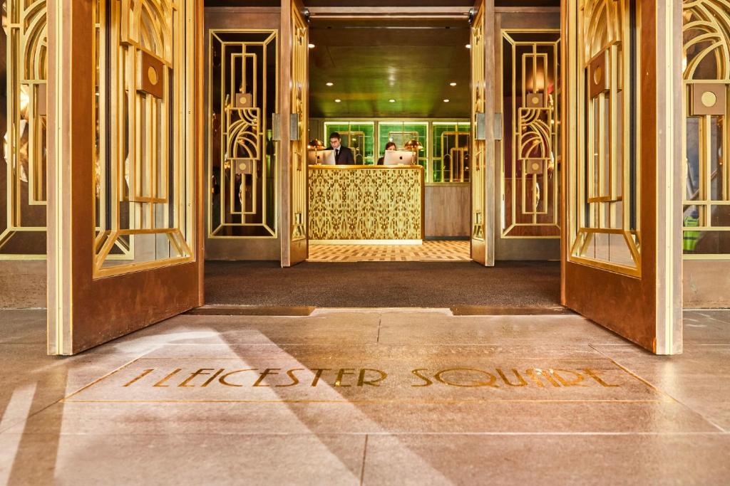 a entrance to a luxury store with the words mitzvah service written on at Hotel Indigo London - 1 Leicester Square, an IHG Hotel in London