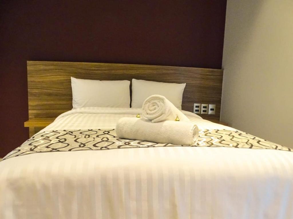 Postel nebo postele na pokoji v ubytování Hotel Luma by Kavia