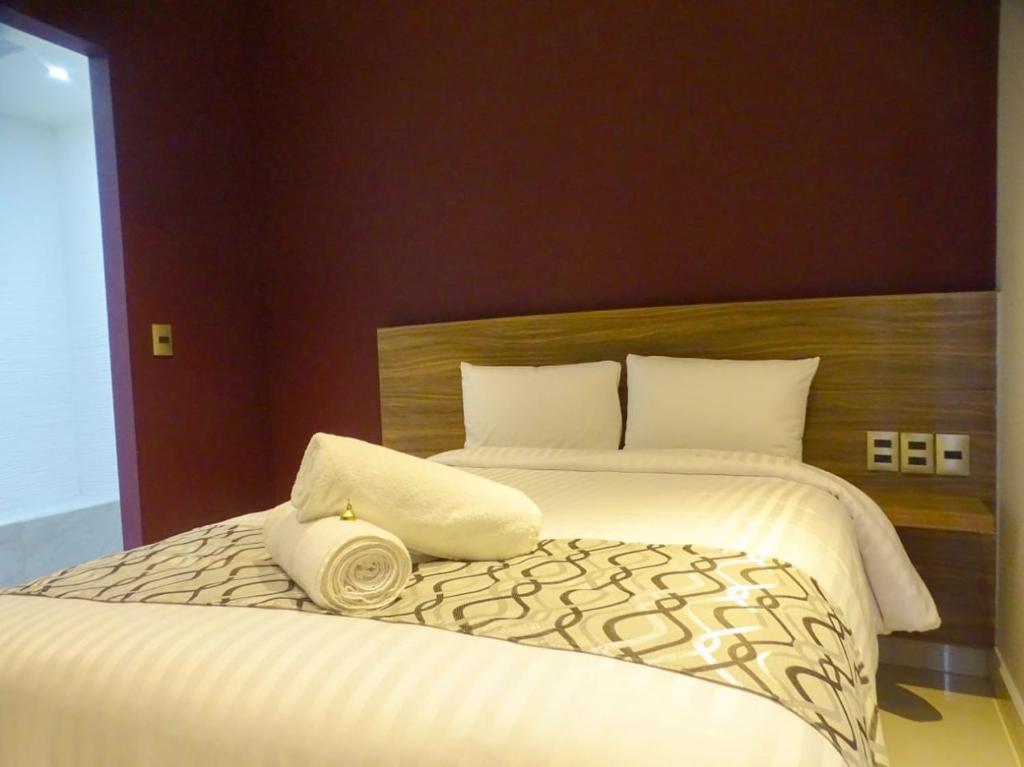 Postel nebo postele na pokoji v ubytování Hotel Luma by Kavia