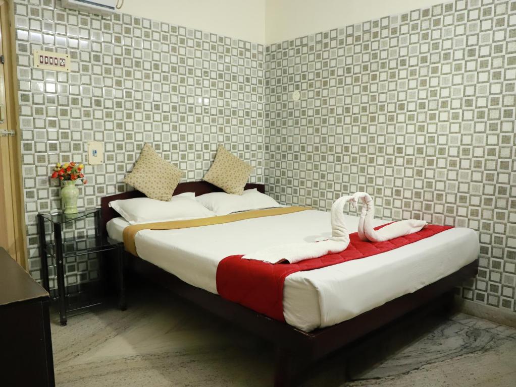 Postel nebo postele na pokoji v ubytování Just Guest House, Chennai Airport