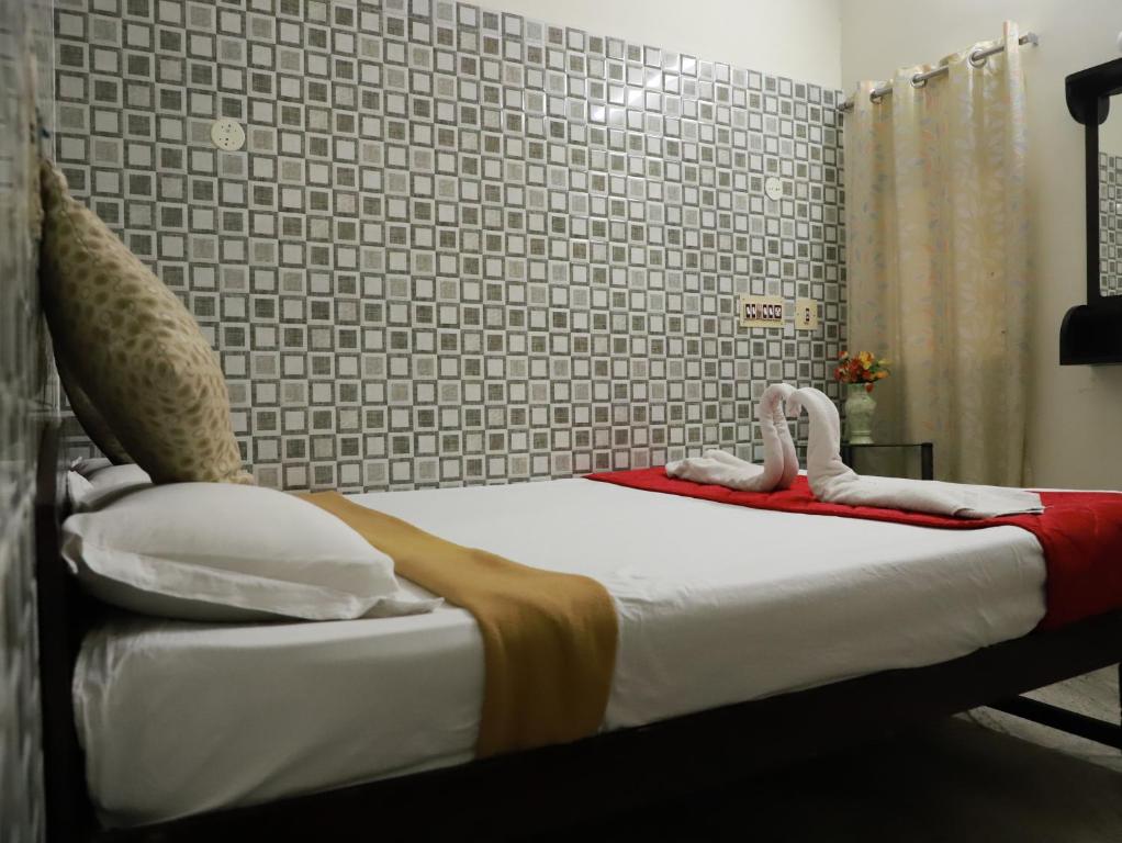 Postel nebo postele na pokoji v ubytování Just Guest House, Chennai Airport
